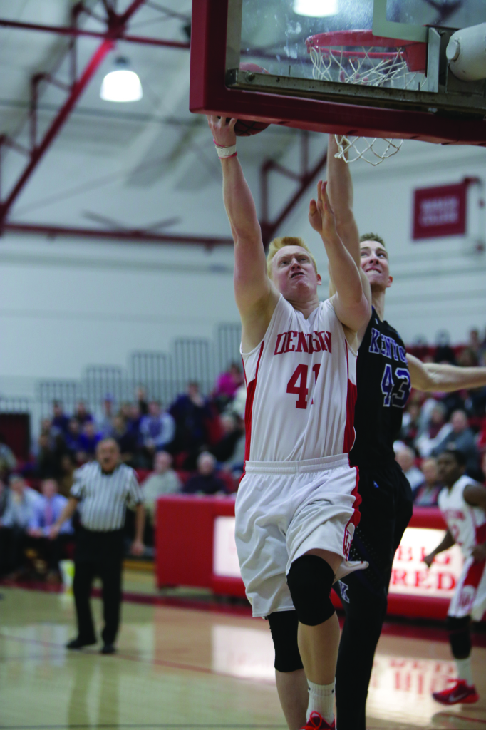Brad Woolard ‘15 powers past a Kenyon defender to the hoop.  He has averaged 9.2 points per game and 5.0 rebounds per game, and DU will look to his leadership heading down the stretch.